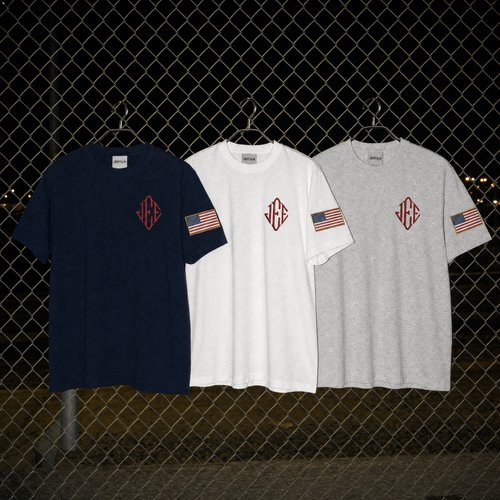 einzip Americana graphic tee in navy with embroidered diamond monogram - front view
